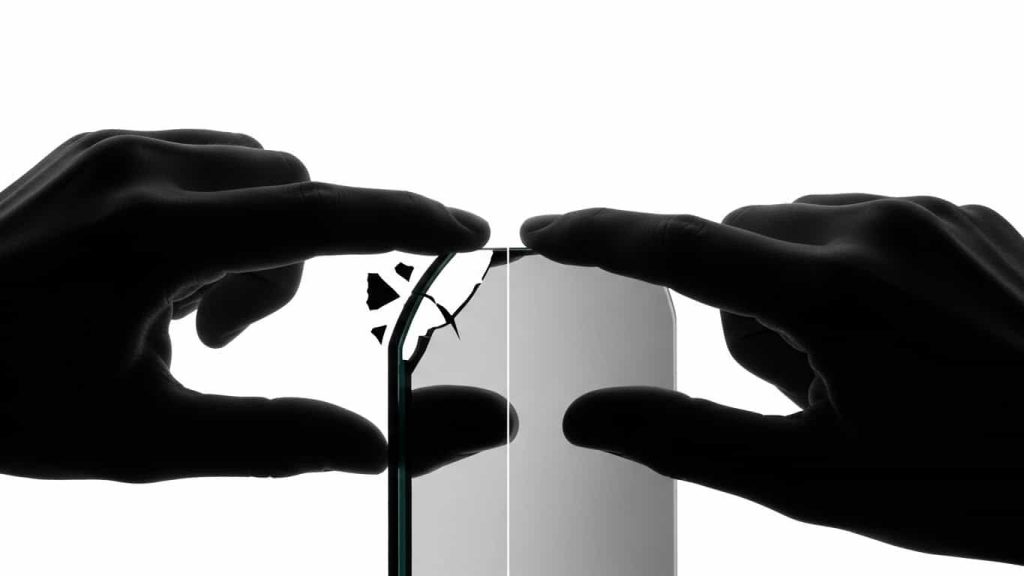 minimal silhouette of hand inspecting mirror edges