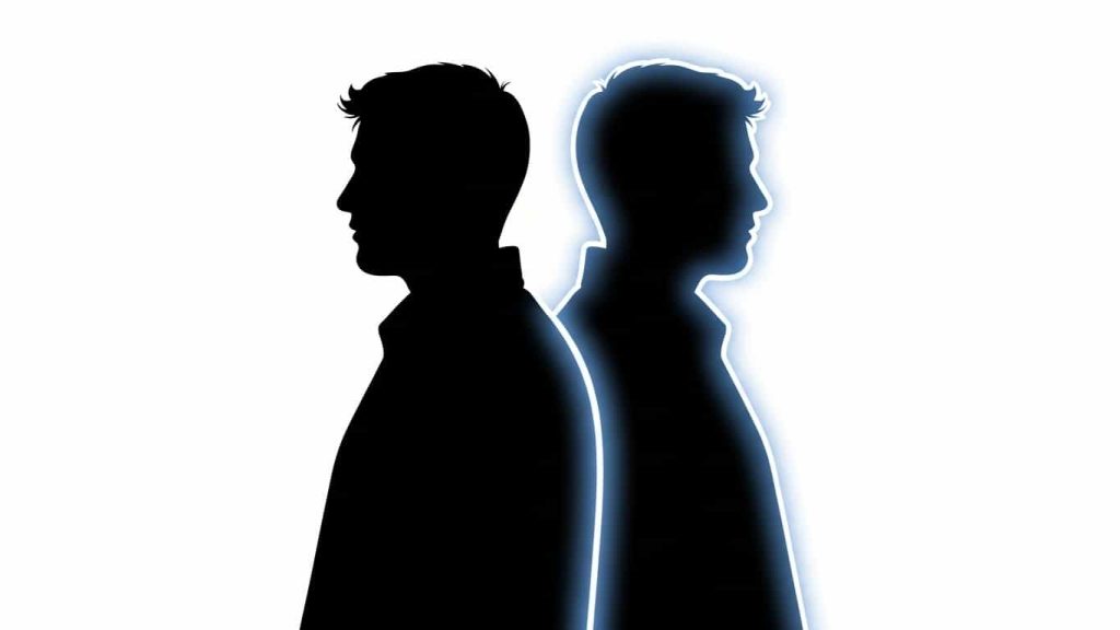 Silhouette of a ghostly double beside a person to represent doppelgängers in folklore.