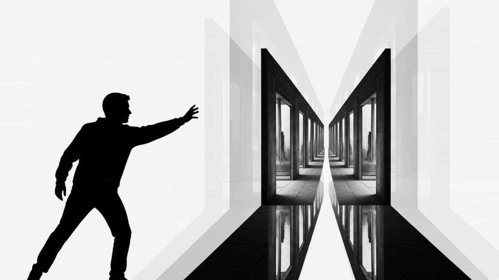 person facing confusing mix of real and reflected paths