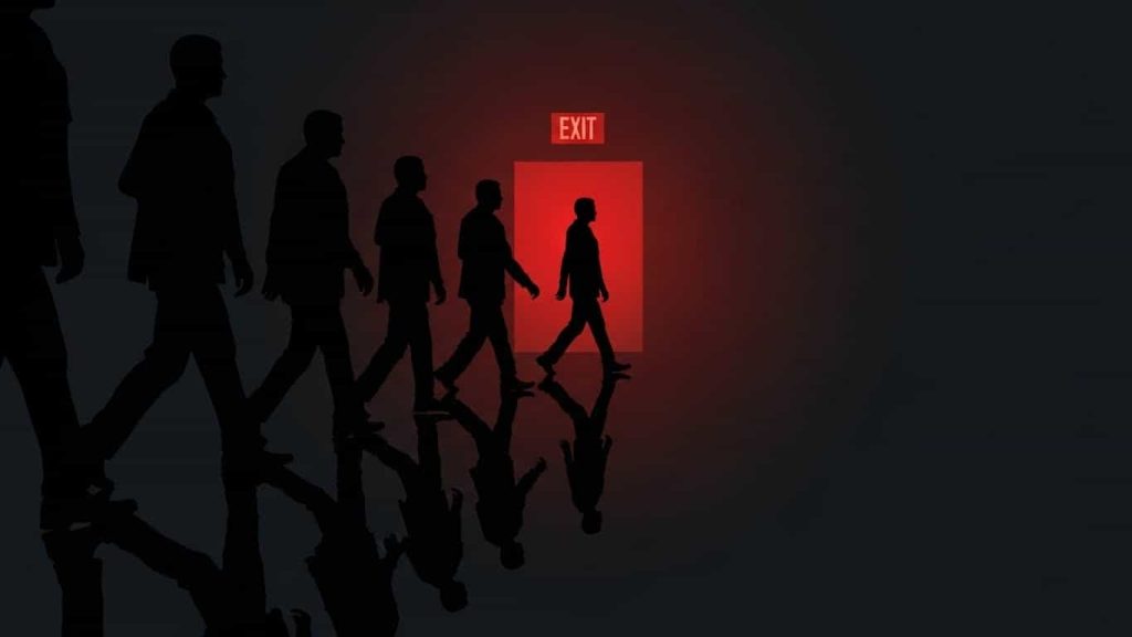 person leaving maze with reflections behind